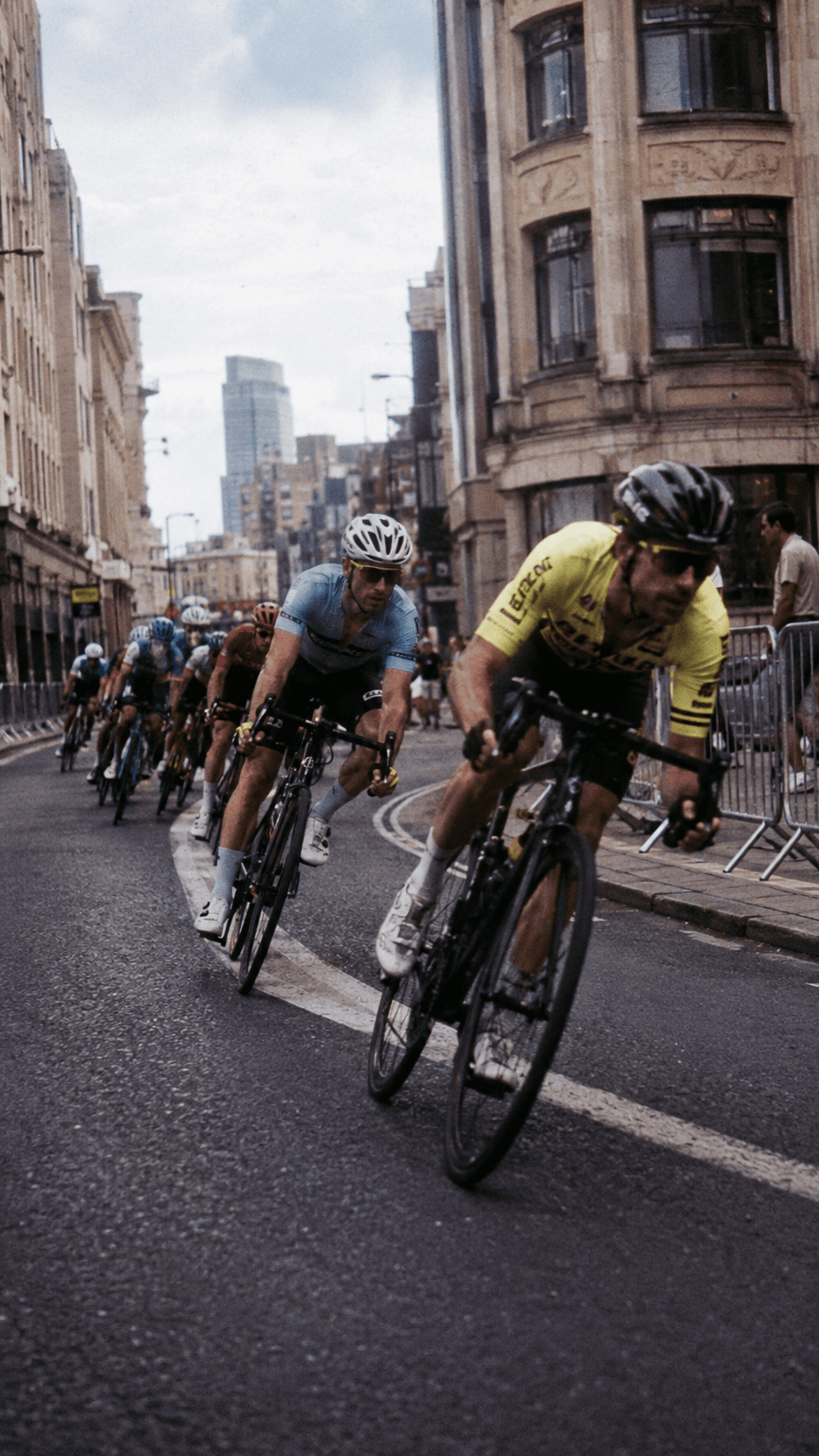 Riders racing through a city street